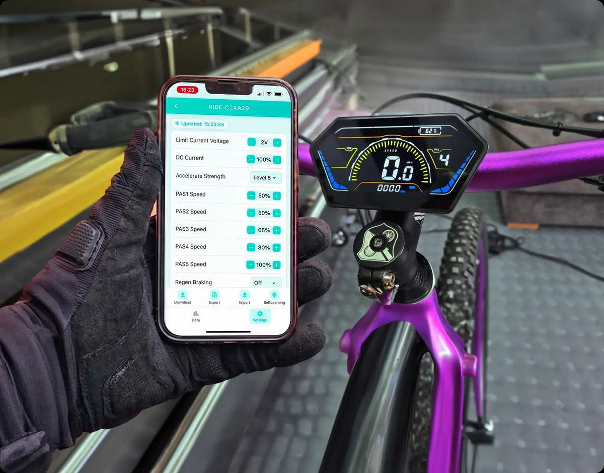 Phone running the Ride Power app next to a KirbEbike colour display on an e-bike